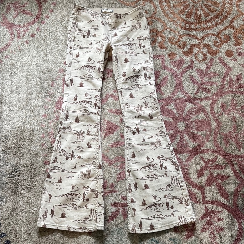 We The Free Cream and Brown Flare Jeans